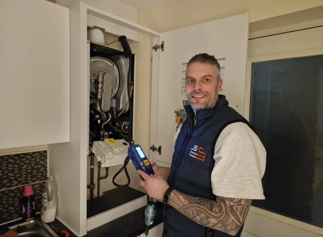 Steven Cowan testing a newly installed boiler with a flue gas analyser